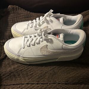 Nike Women's White Low-Top Sneakers with khaki Swoosh